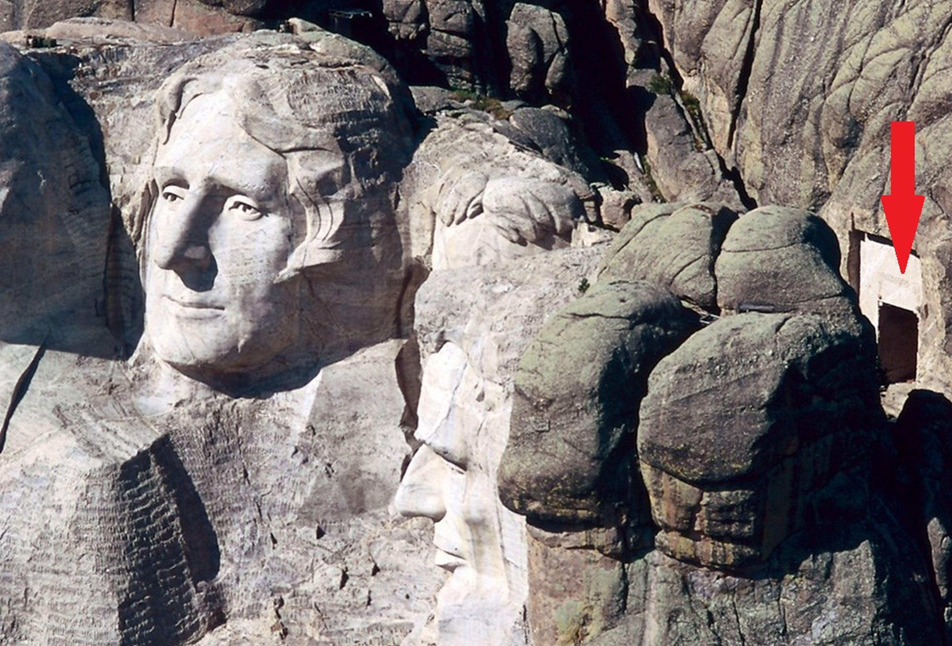 What hides the hidden camera behind the heads of Mount Rushmore?